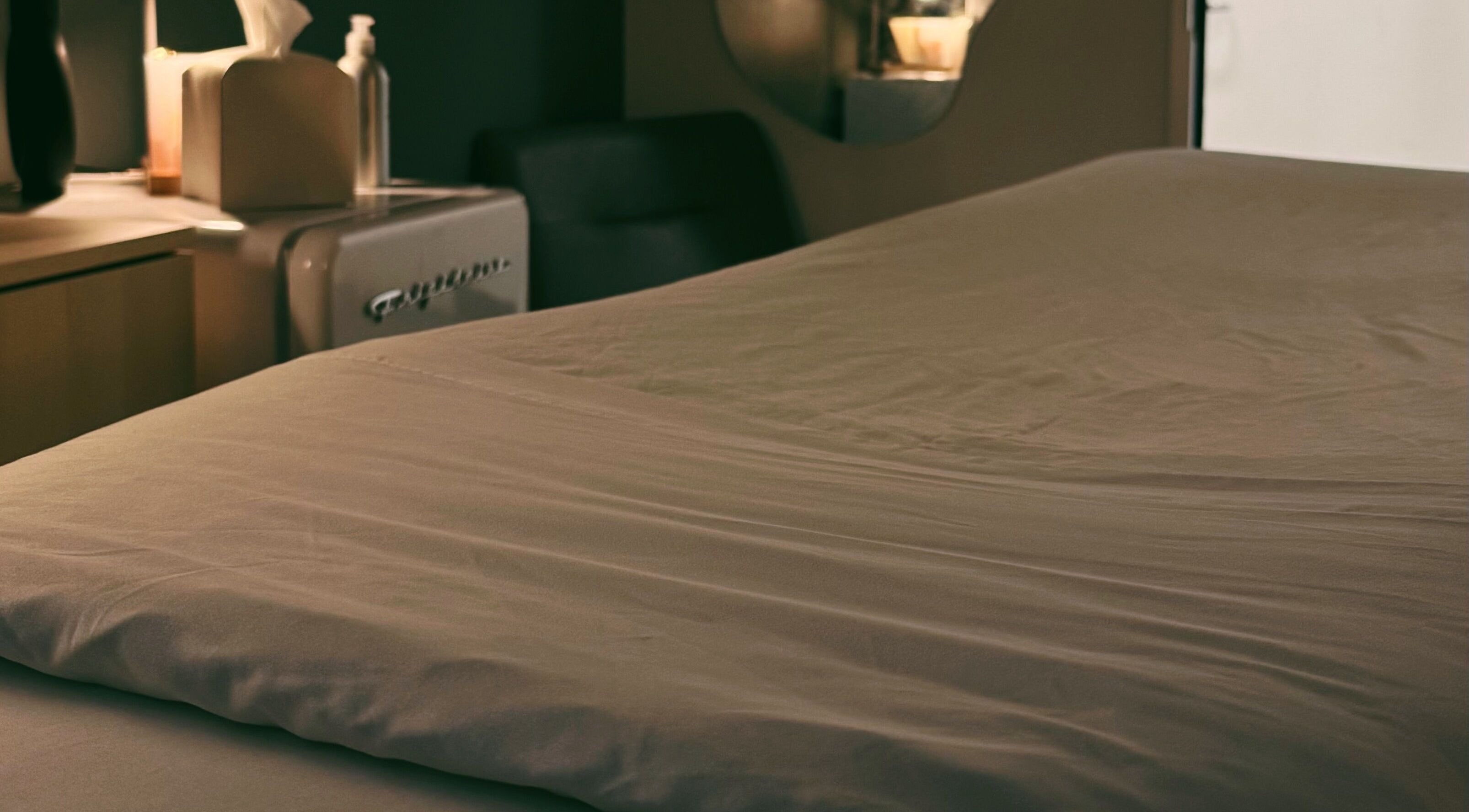 Cozy treatment room at Lyla Skin Studio, Aliso Viejo, California, US, ready for a relaxing session.