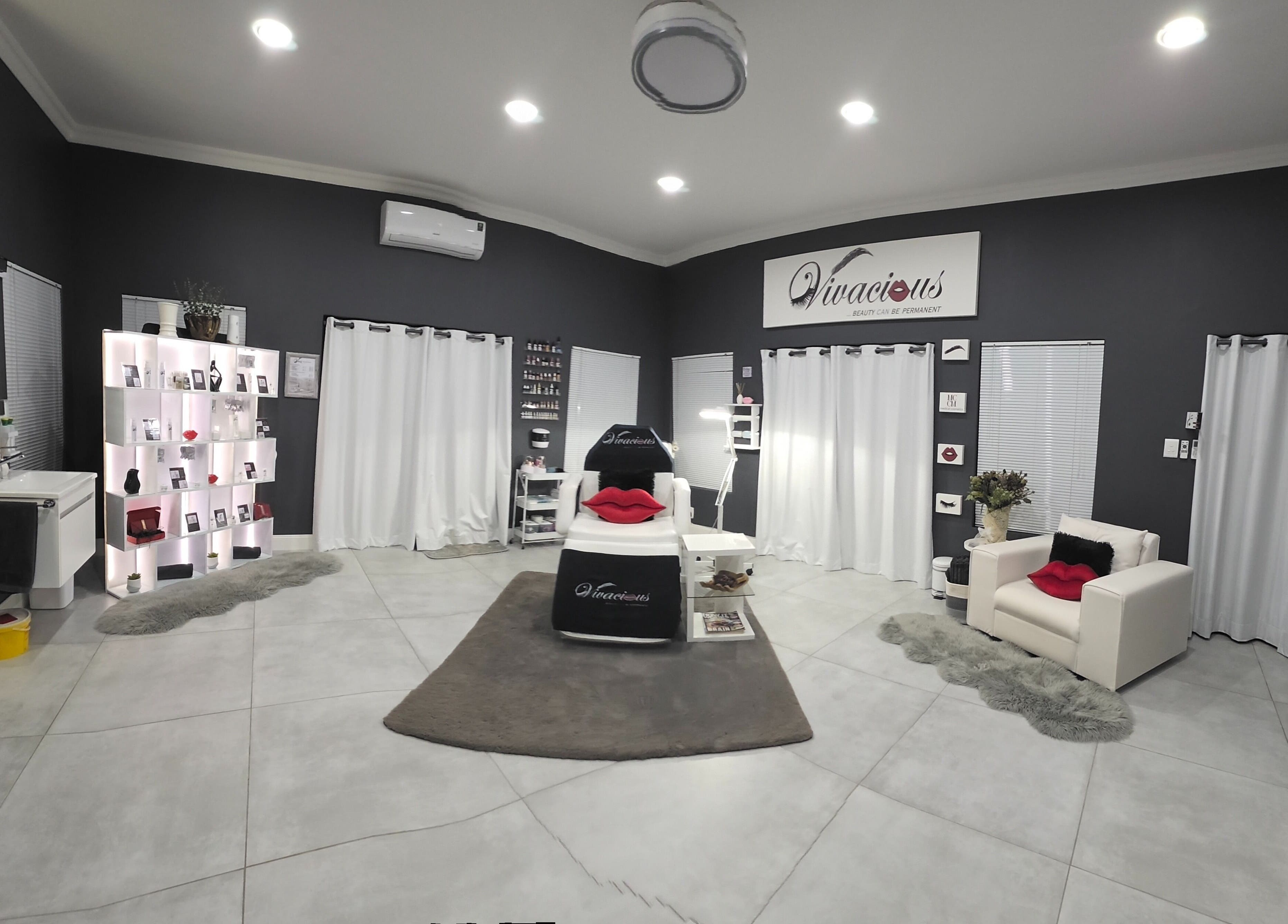 Modern interior of Vivacious Permanent Beauty in Pretoria, Gauteng, ZA with sleek decor and treatment areas.