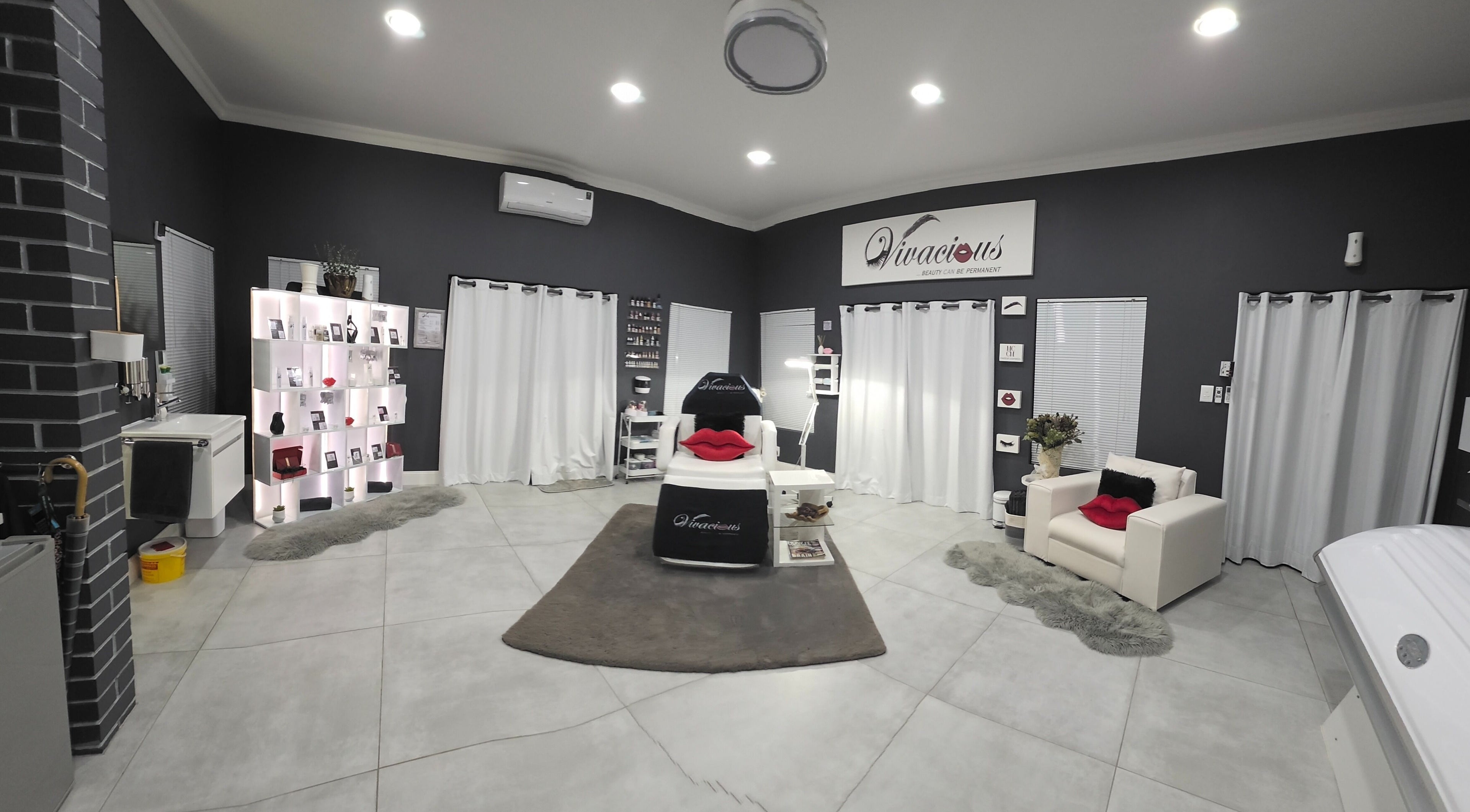 Modern interior of Vivacious Permanent Beauty in Pretoria, Gauteng, ZA with sleek decor and treatment areas.