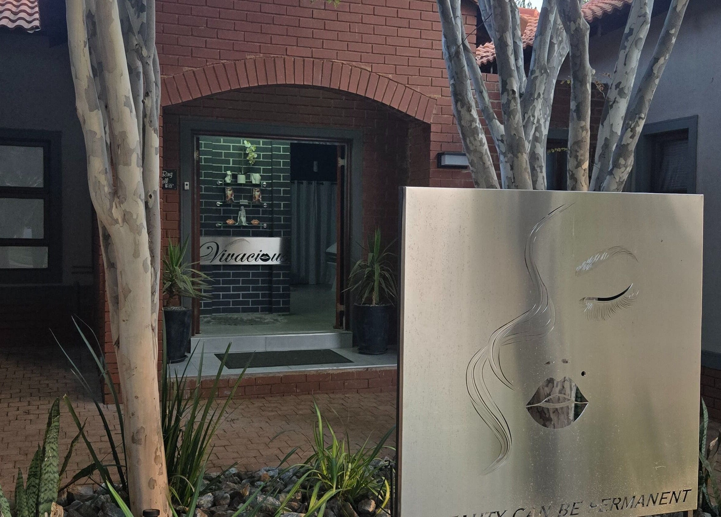 Entrance to Vivacious Permanent Beauty, Pretoria, Gauteng, ZA featuring elegant signage and natural decor.
