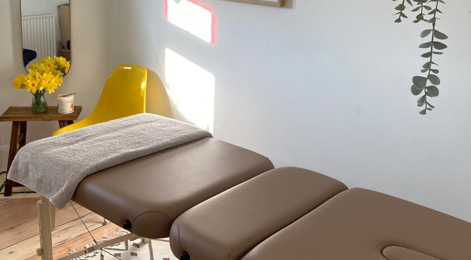 Relaxing massage room at Anna Herbert Massage, London, England, GB, featuring a cozy table and calming decor.