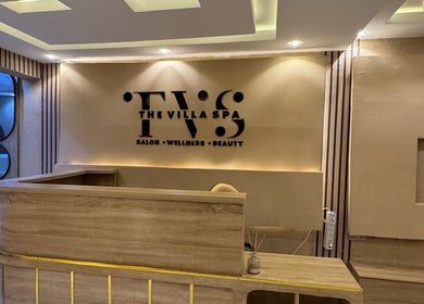 The Villa Spa reception area featuring sleek wooden desk in Awka, Anambra, NG.