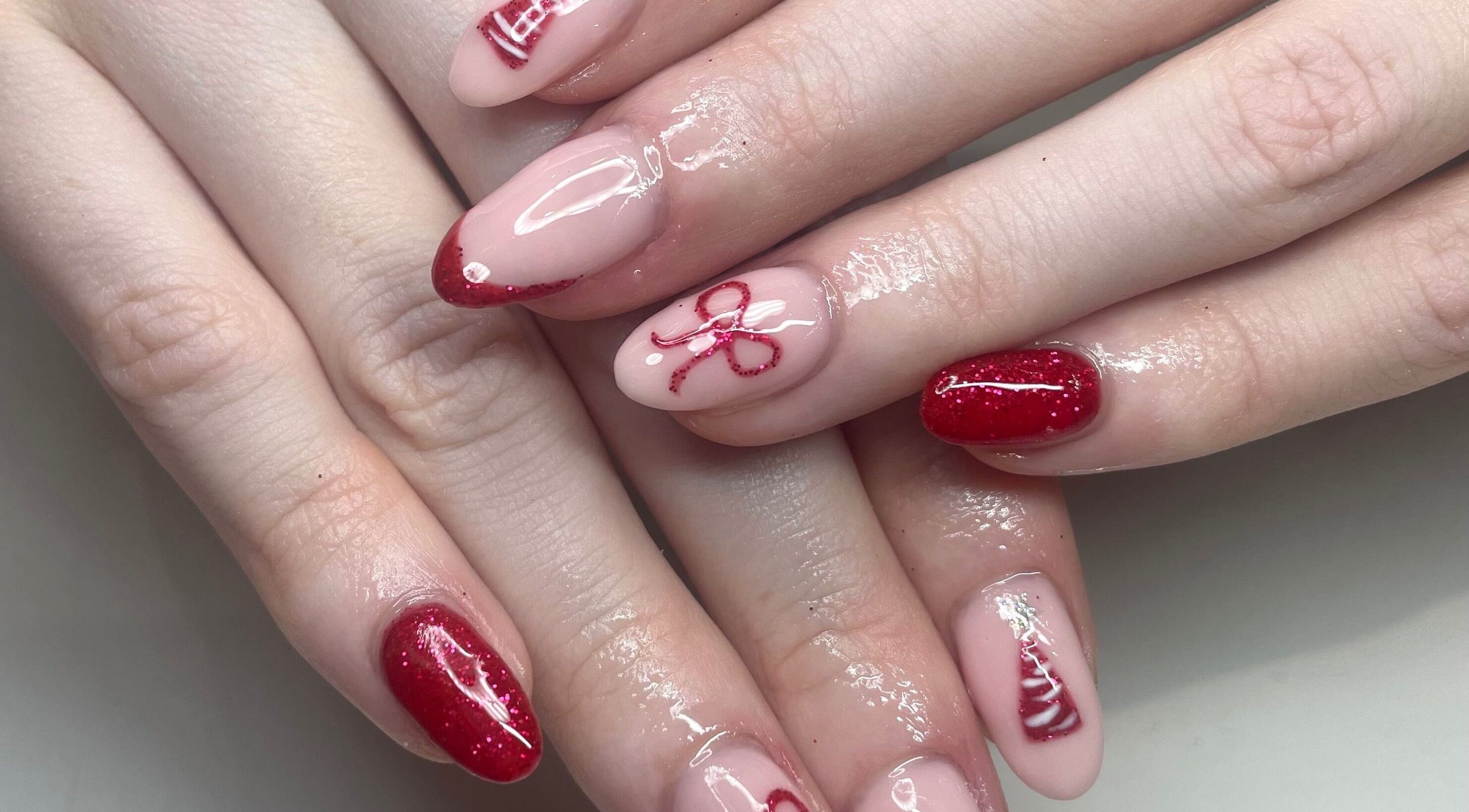 Elegant red nail art at The Blossom Lounge, Arbroath, Scotland, GB. Perfect manicure for special occasions.
