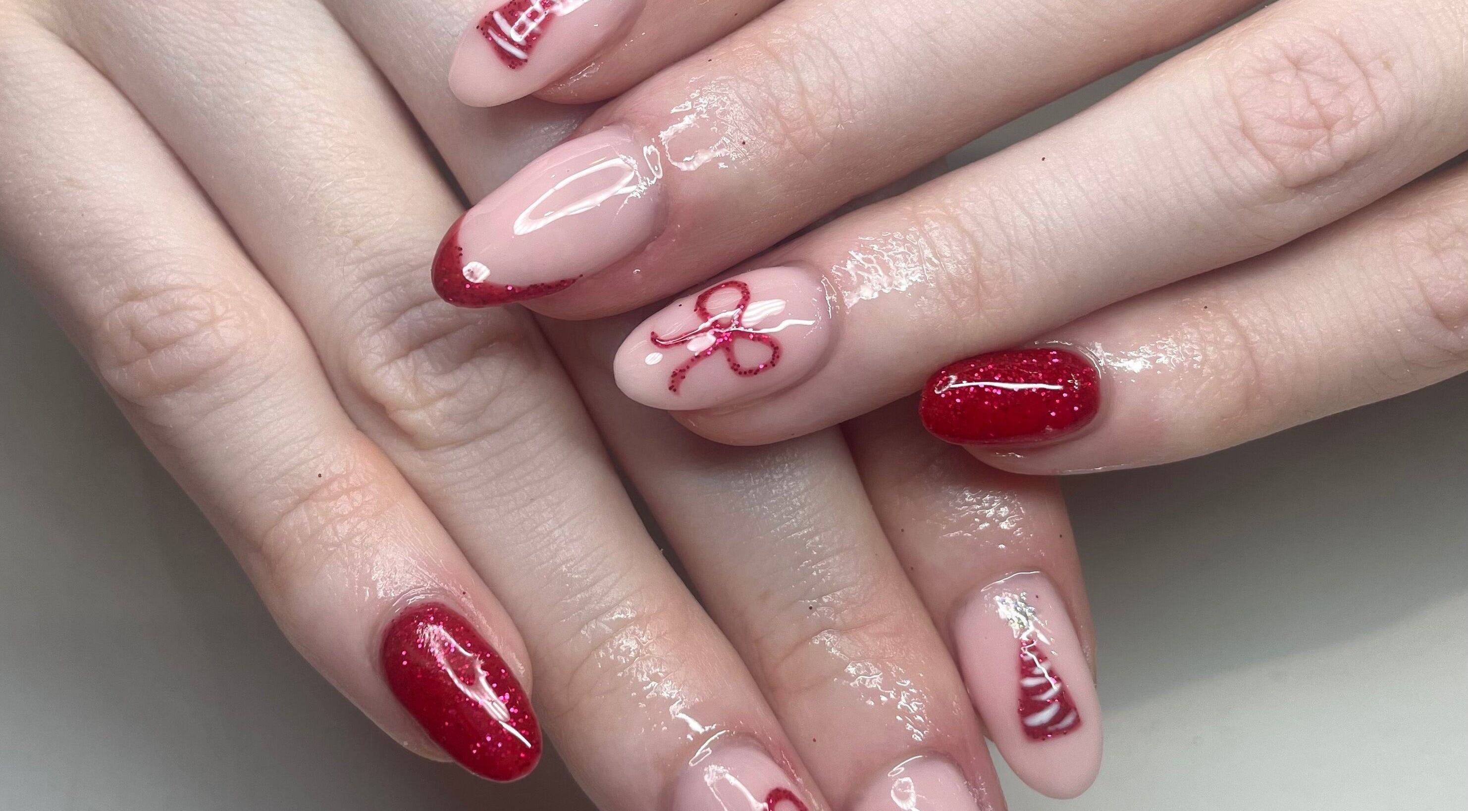 Elegant red nail art at The Blossom Lounge, Arbroath, Scotland, GB. Perfect manicure for special occasions.
