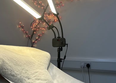 Warm ambiance in treatment room at Velvet Beauty, London, England, GB with professional lighting setup.