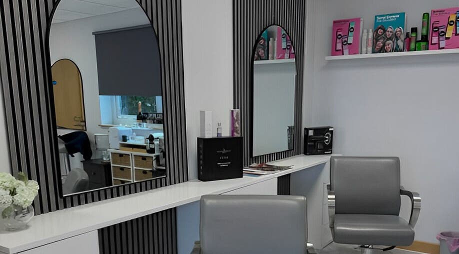Modern salon interior at Barbara Sue Aesthetics Ltd, Felixstowe, England, GB with sleek styling stations.