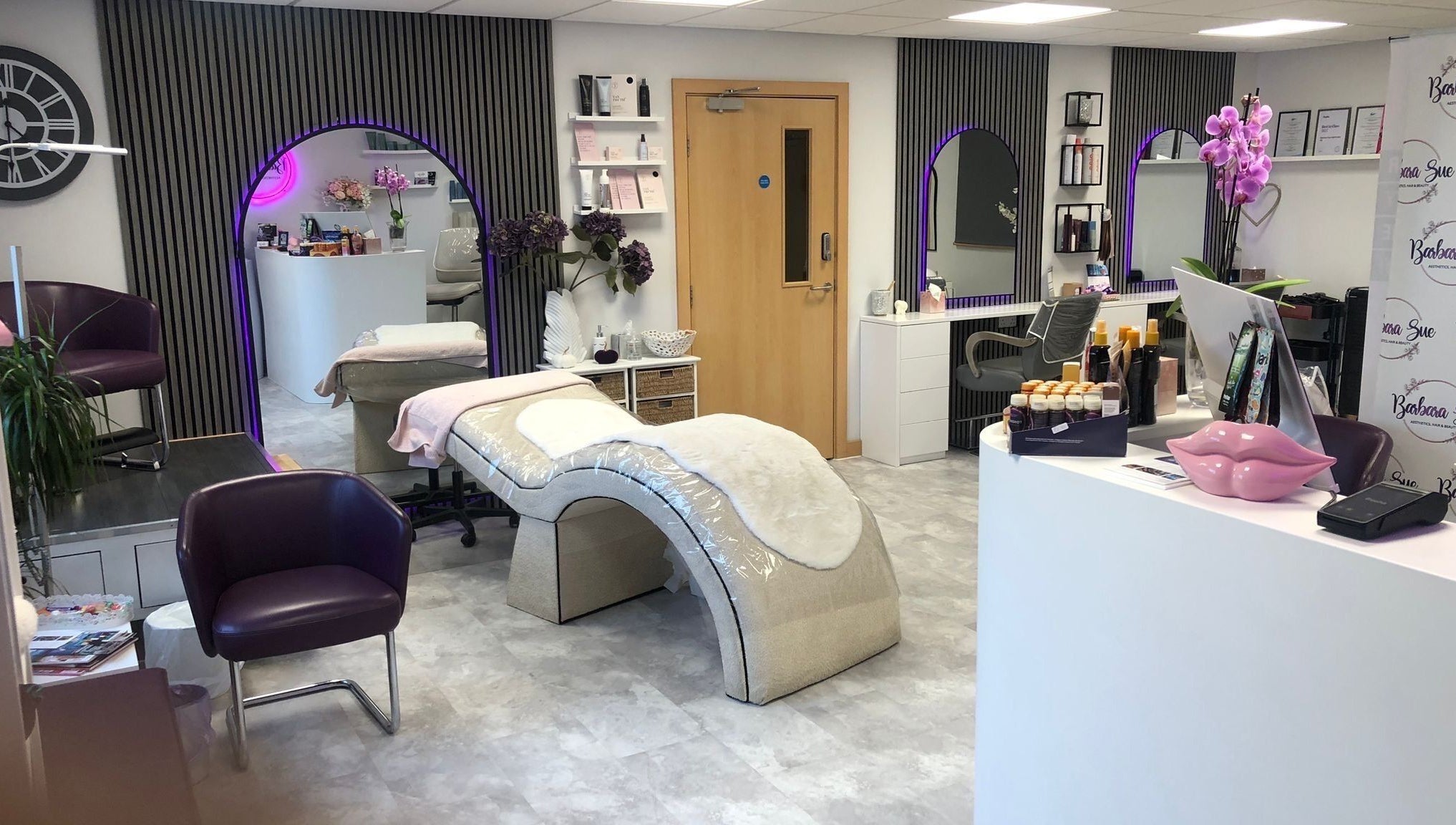 Elegant interior of Barbara Sue Aesthetics Ltd, Felixstowe, England, GB. Modern treatment area with plush decor.
