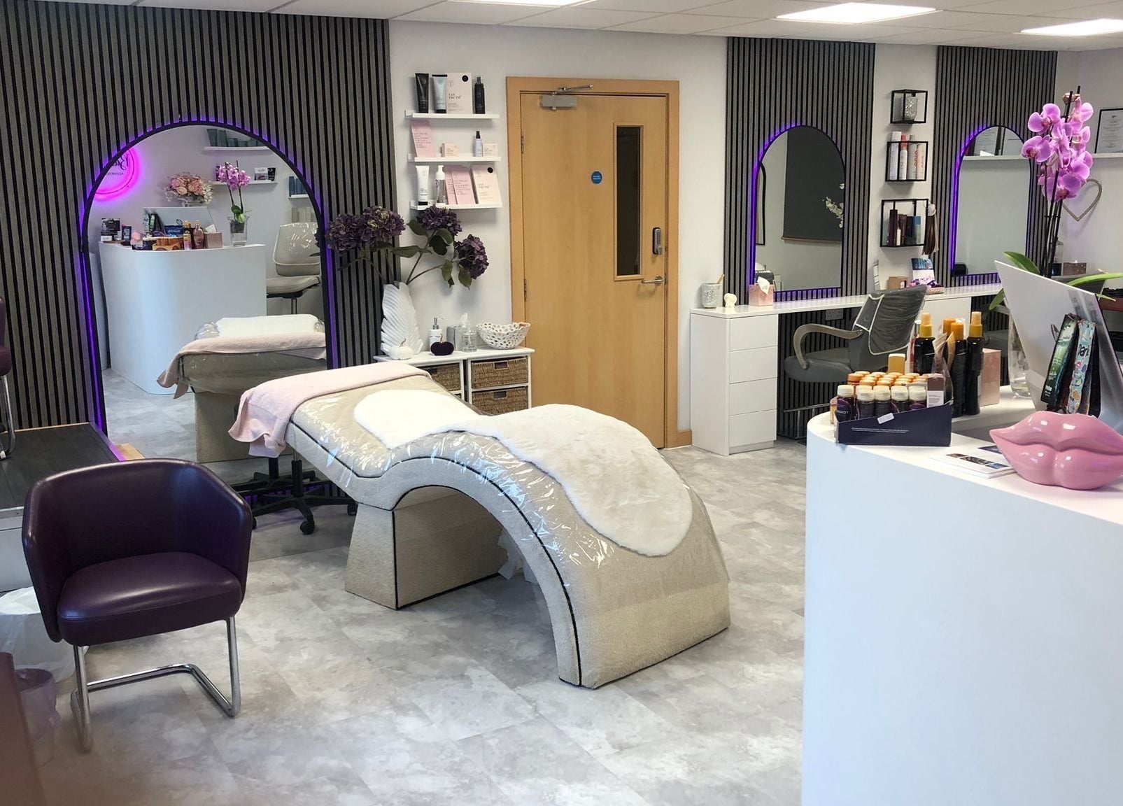 Elegant interior of Barbara Sue Aesthetics Ltd, Felixstowe, England, GB. Modern treatment area with plush decor.