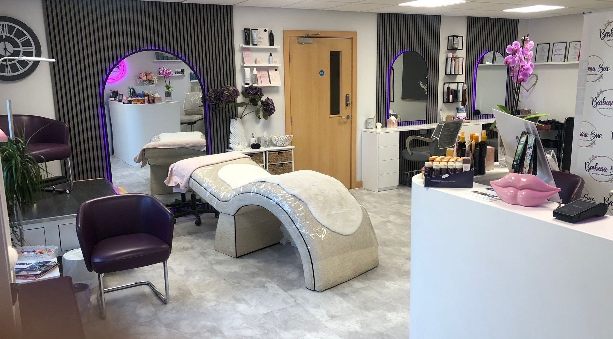 Elegant interior of Barbara Sue Aesthetics Ltd, Felixstowe, England, GB. Modern treatment area with plush decor.