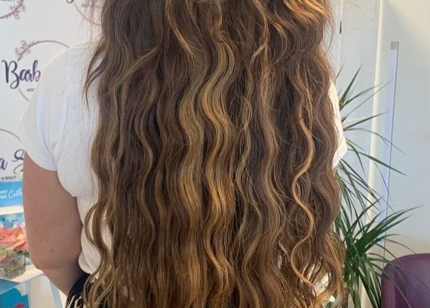Long wavy hair styled at Barbara Sue Aesthetics Ltd, Felixstowe, England, GB.