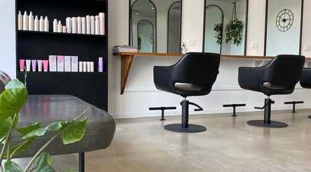 Elegant salon chairs and mirrors at Mane Haus, Melbourne, Victoria, AU showcasing a modern aesthetic.