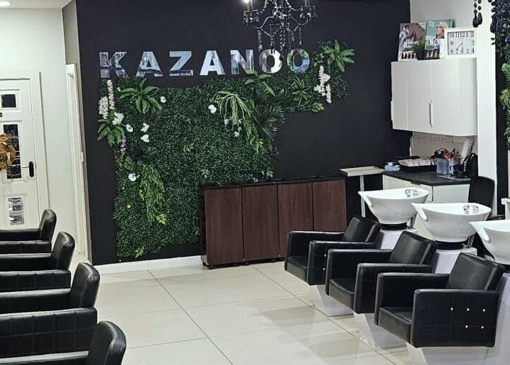 Modern salon interior at Kazanoo Hair By Adrian, Galway, County Galway, IE, featuring sleek black styling chairs.