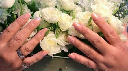 Hand On Nails and Hair image 2