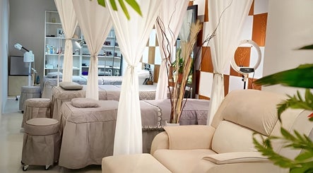 Elegant spa interior at Julia Beauty at Orchard, Singapore, SG with plush chairs and serene decor.
