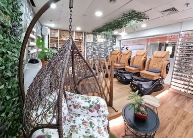 Relaxing aesthetic of Julia Beauty at Orchard, Singapore, with plush seating and vibrant decor.