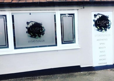 Front window of Lush Beauty and Massage in Heath Hayes, England, GB showcasing logo and services.