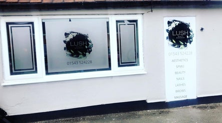 Front window of Lush Beauty and Massage in Heath Hayes, England, GB showcasing logo and services.