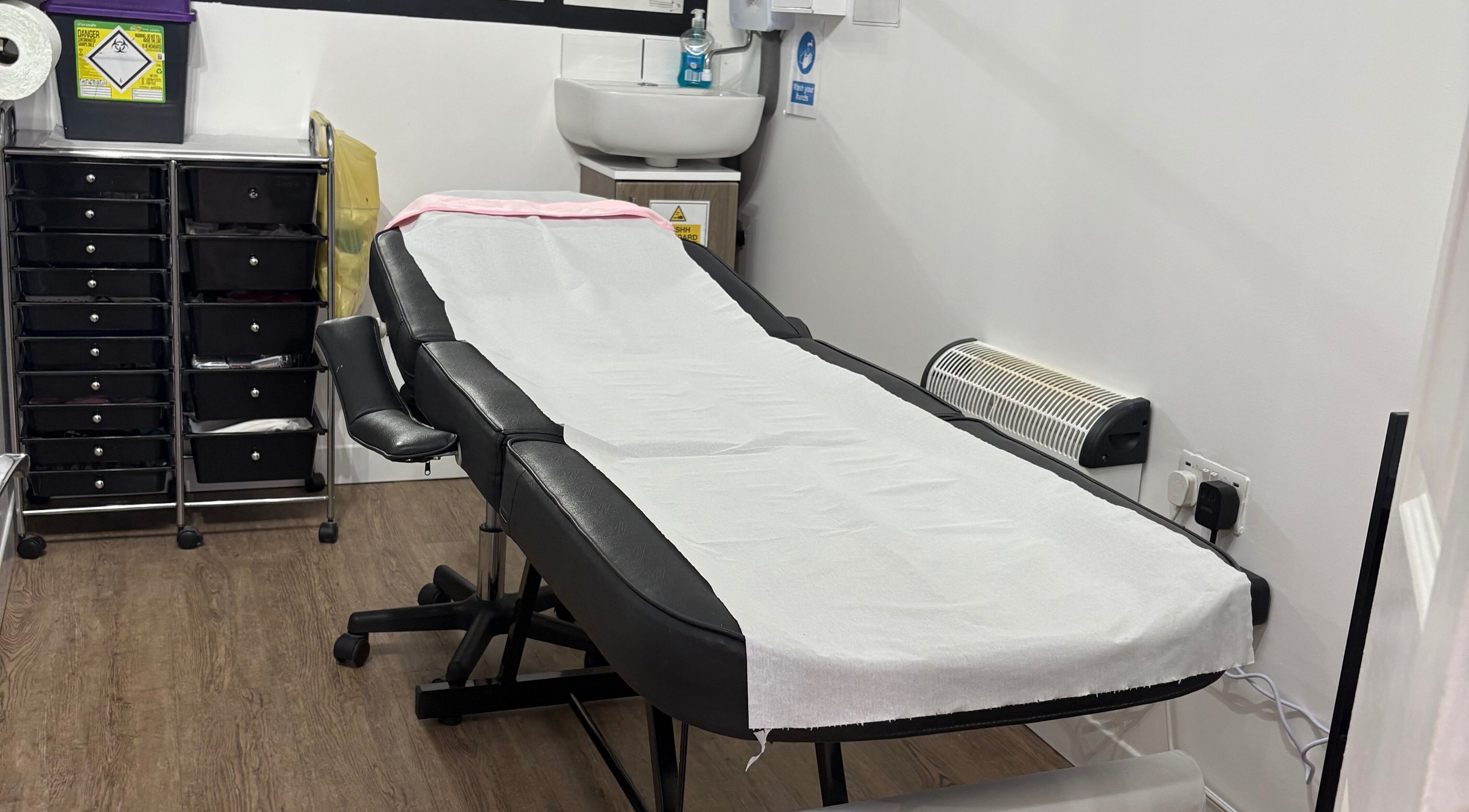 Calming treatment room at Lush Beauty and Massage, Heath Hayes, England, GB, featuring a comfortable massage table.