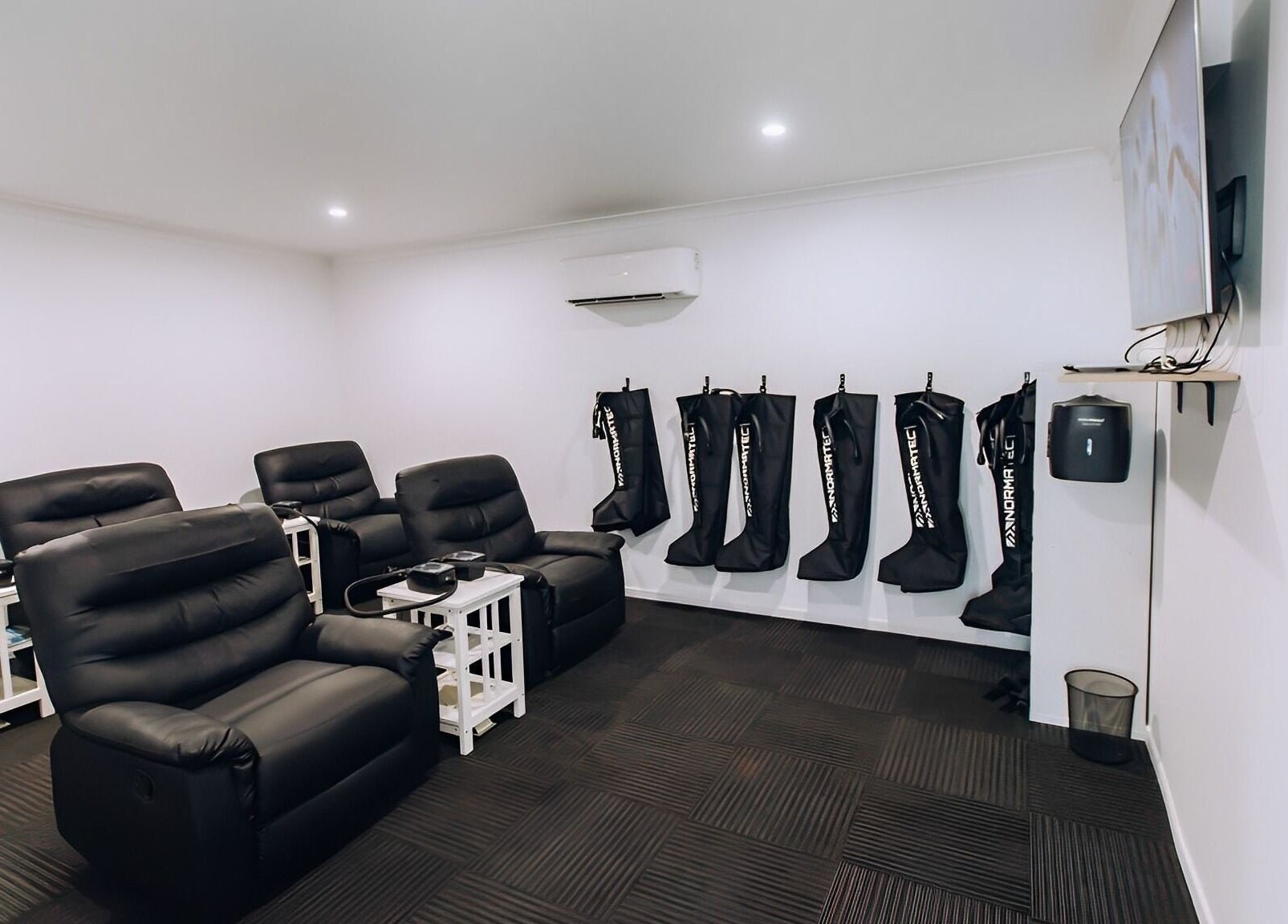 TLC Recovery's cozy lounge with recliners and wellness equipment in Alexandra Headland, Queensland, AU.