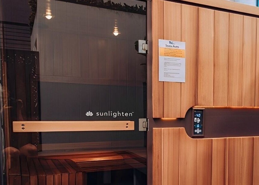 Sunlighten sauna at TLC Recovery, Alexandra Headland, Queensland, AU. Wood paneling and display control visible.