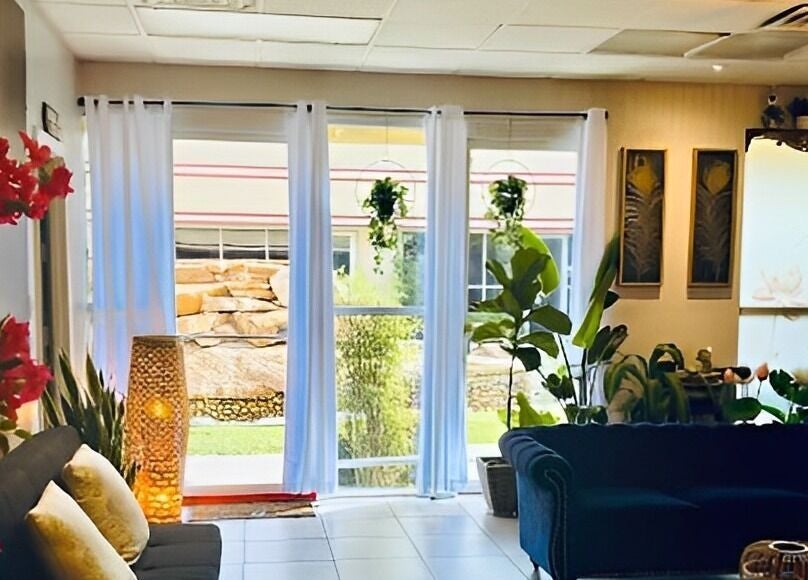 Luxurious interior of LUXE Thai Spa & Massage in Las Vegas, Nevada, US, featuring plush seating and vibrant decor.