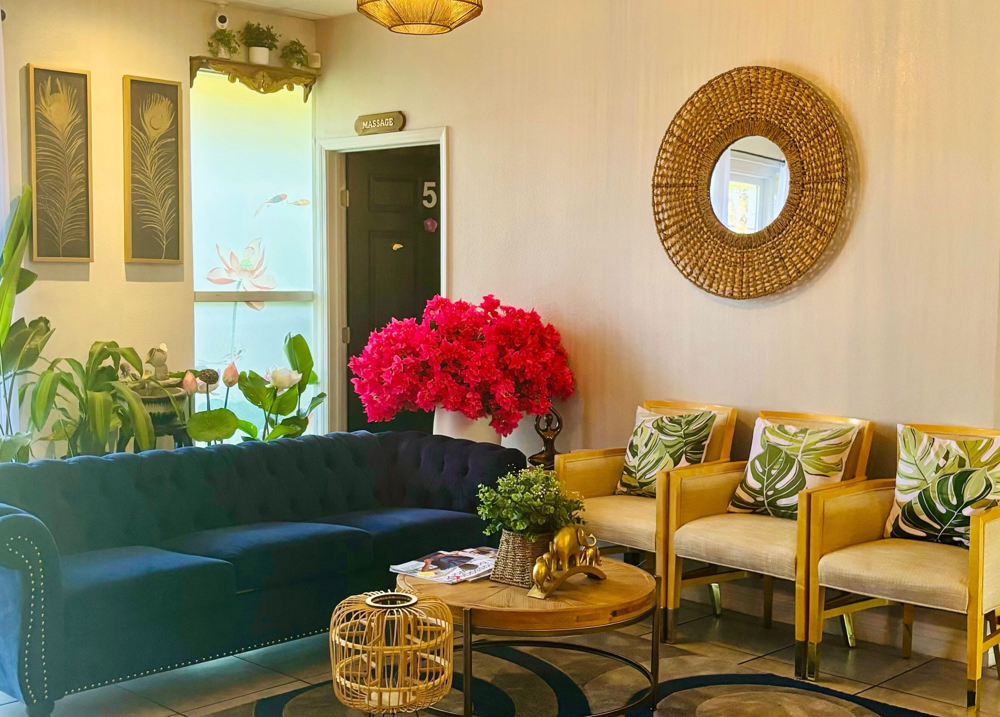 Elegant lobby at LUXE Thai Spa & Massage, Las Vegas, Nevada, US, featuring plush seating and vibrant decor.