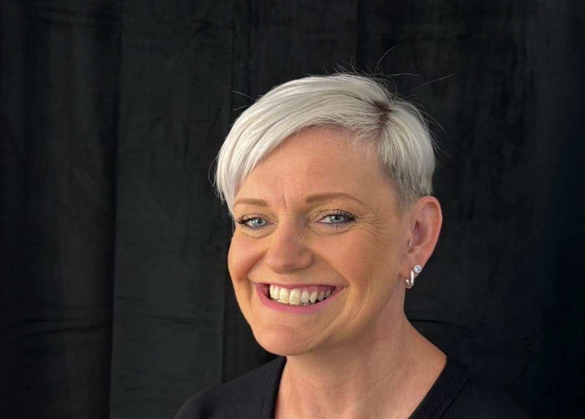 A smiling client with short hair at Stephanie Clark in Winkfield, GB, showcasing expert styling.