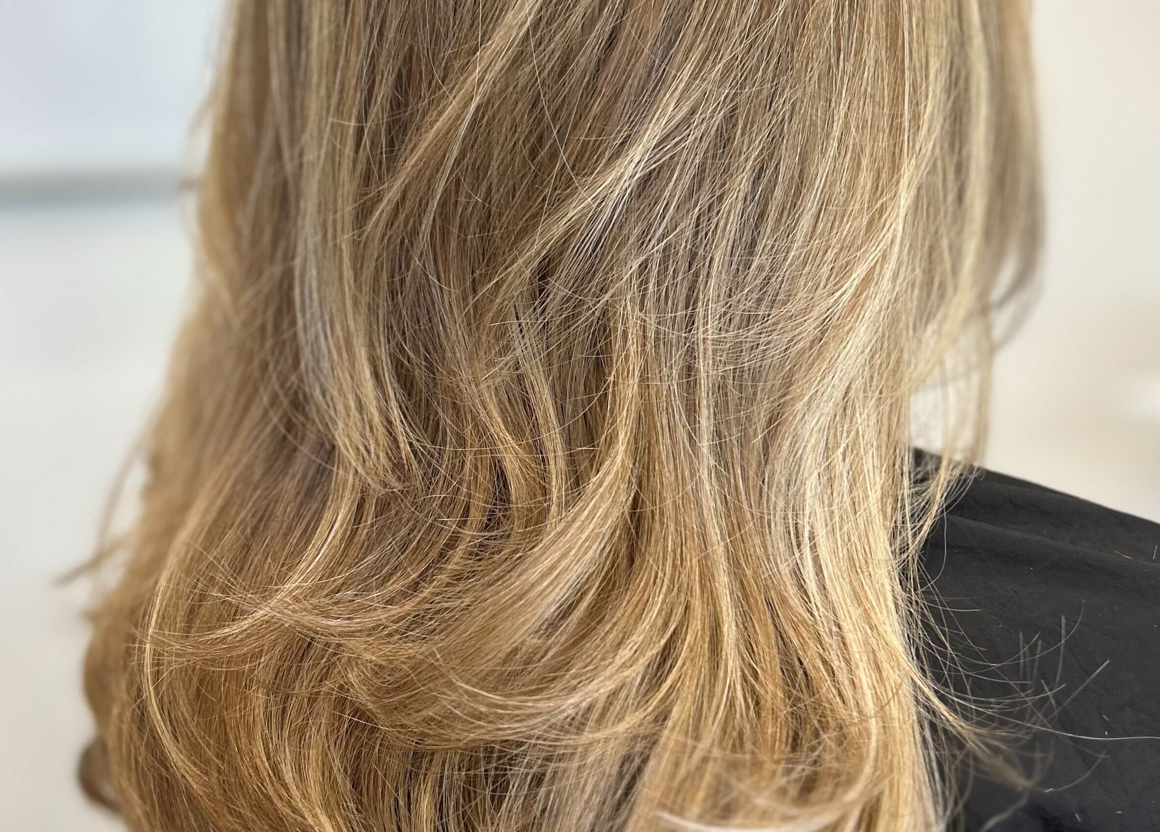 Styled blonde hair at Stephanie Clark, Winkfield, GB, showcasing professional salon services.