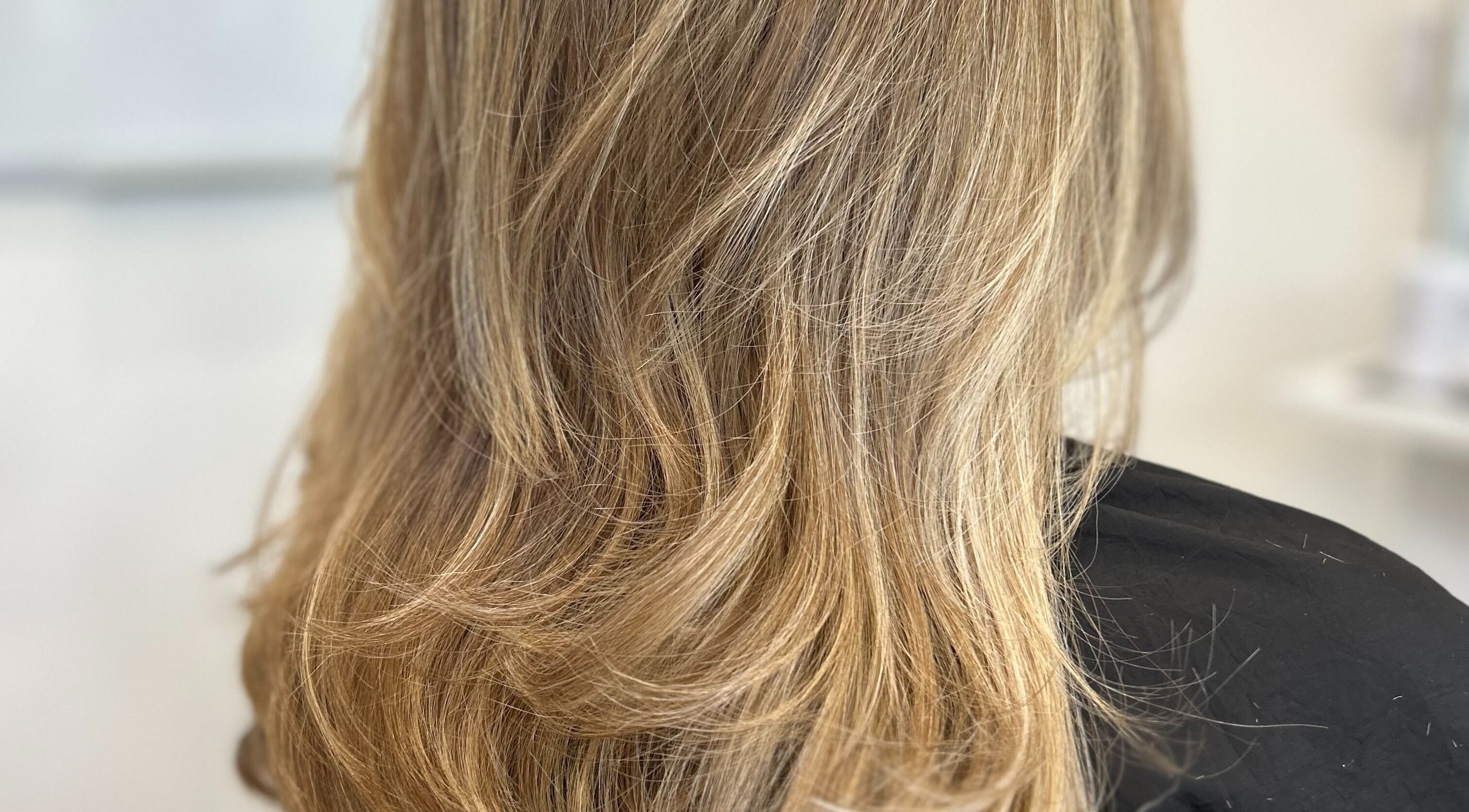 Styled blonde hair at Stephanie Clark, Winkfield, GB, showcasing professional salon services.