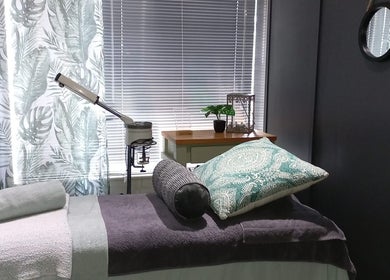 Relaxing spa room at House of Beauty and Skincare, Grabouw, Western Cape, ZA, featuring a comfy massage bed.