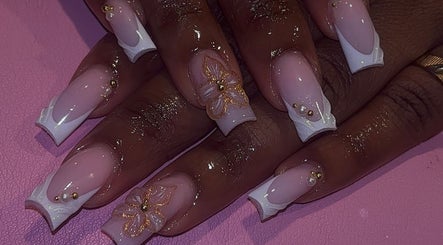 Stylish pink and white nails with floral design at That Girl Collection, Ajax, CA.