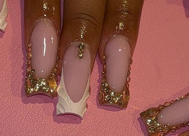 Elegant nail art with gold and pink embellishments at That Girl Collection, Ajax, CA.