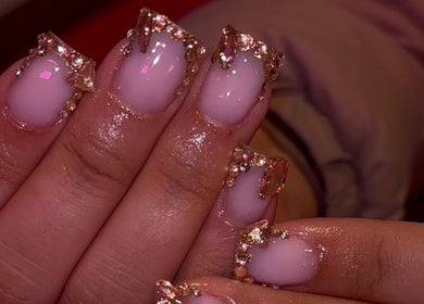 Luxurious jeweled manicure at That Girl Collection in Ajax, CA, showcasing intricate nail art design.