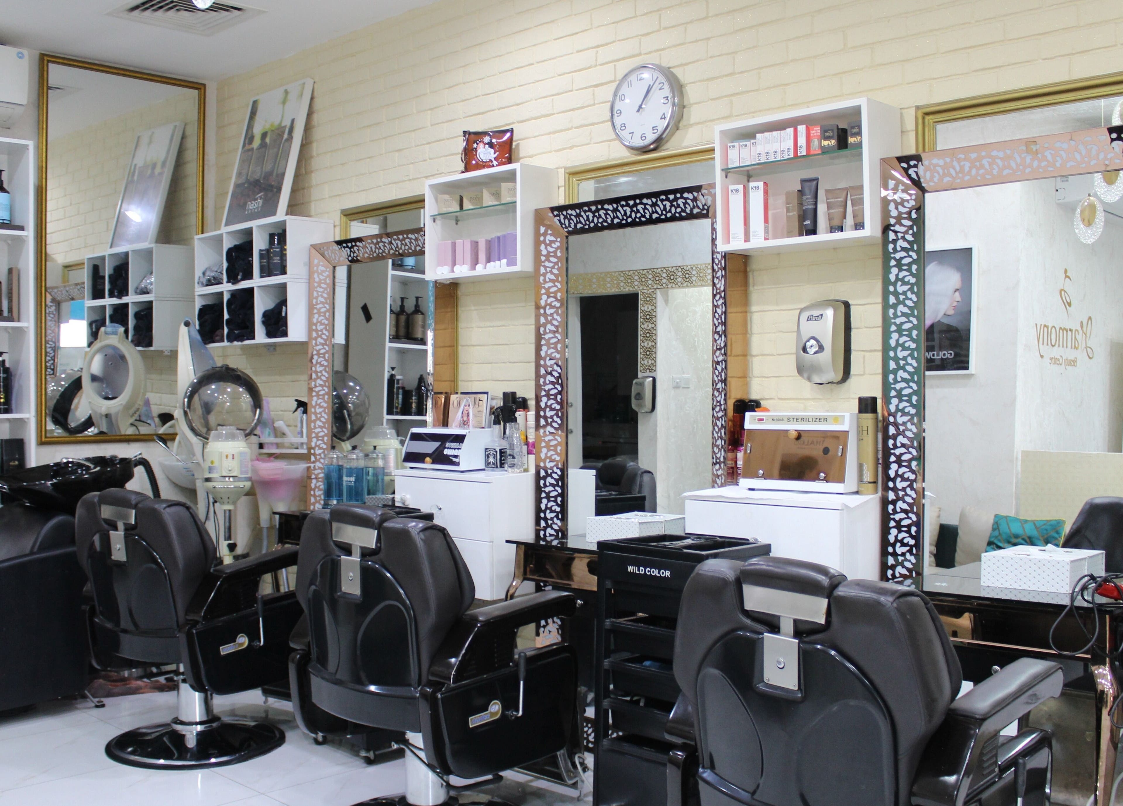 Interior of Harmony Ladies Salon in Dubai, showcasing modern styling stations and chic decor.