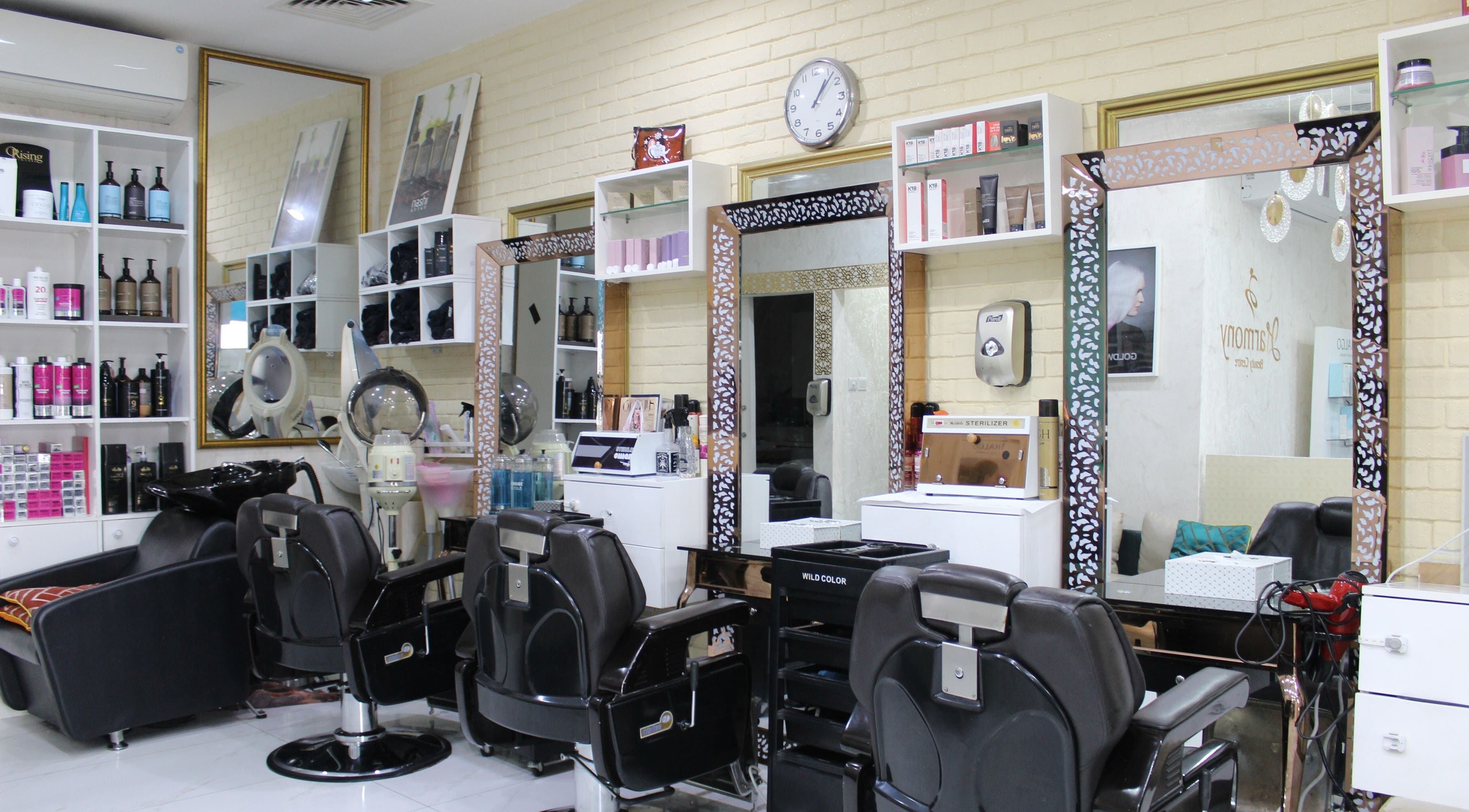 Interior of Harmony Ladies Salon in Dubai, showcasing modern styling stations and chic decor.