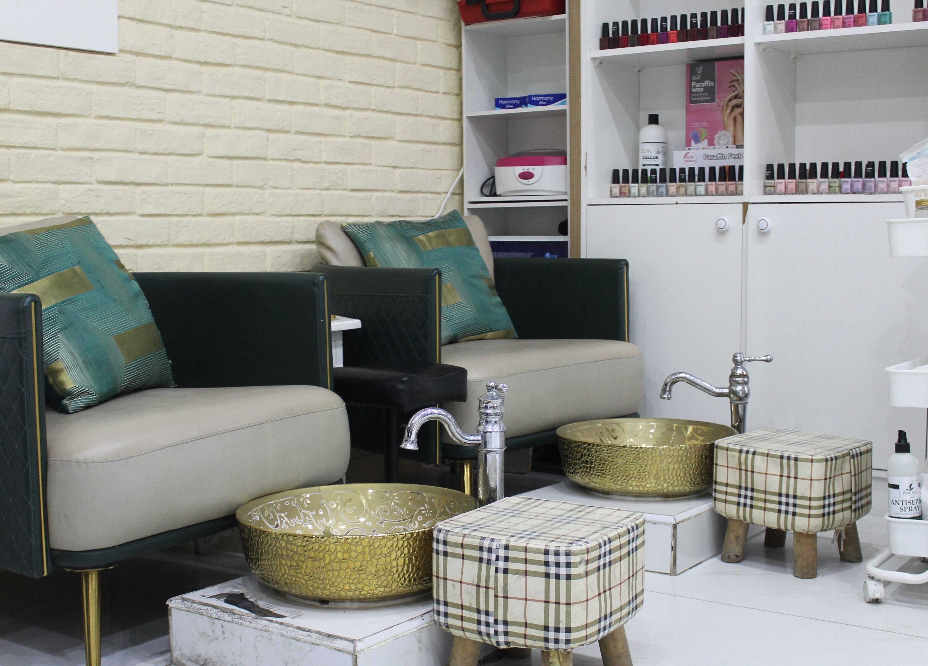 Luxurious pedicure area at Harmony Ladies Salon, Dubai, Dubai, AE. Features plush seating and gold basins.