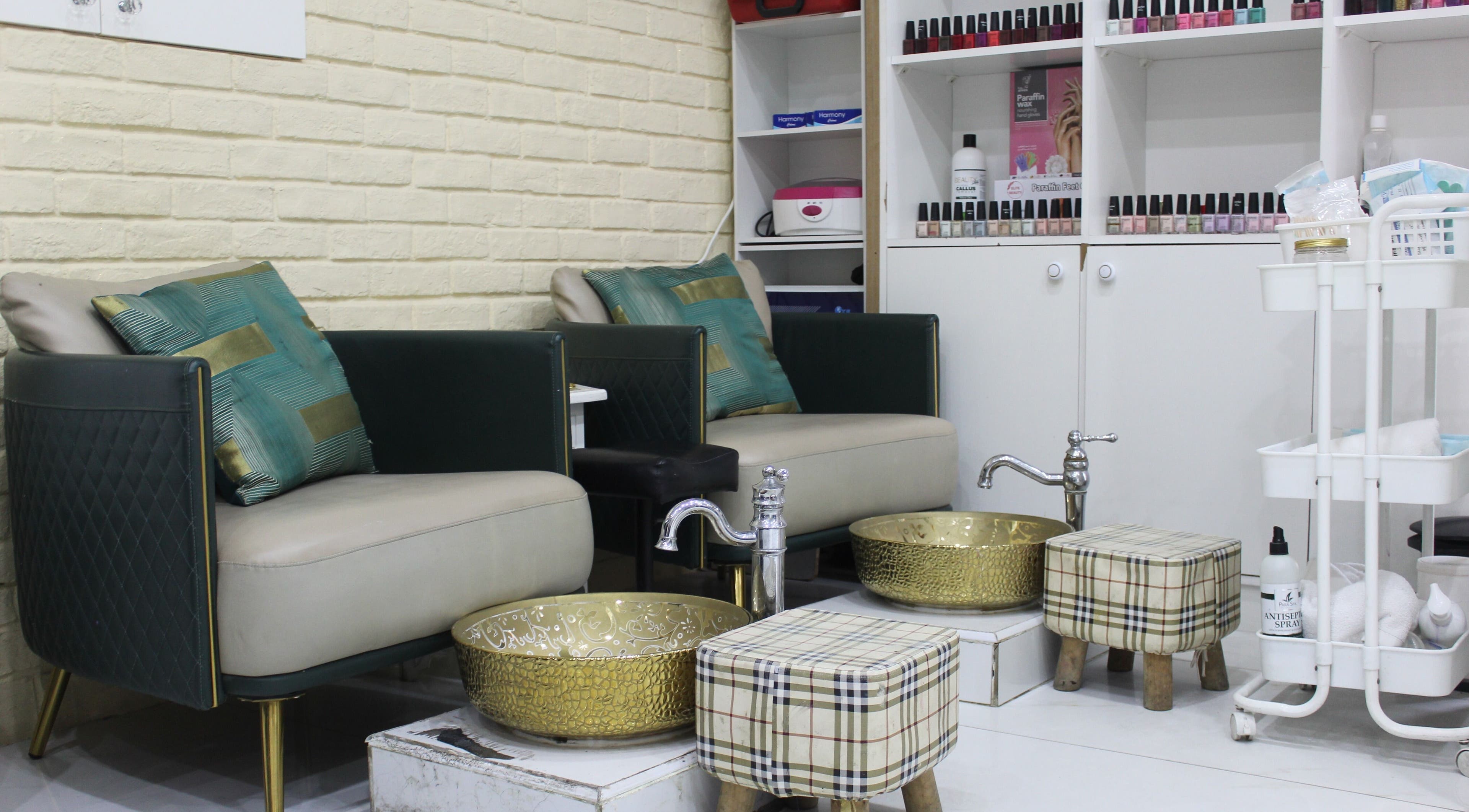 Luxurious pedicure area at Harmony Ladies Salon, Dubai, Dubai, AE. Features plush seating and gold basins.