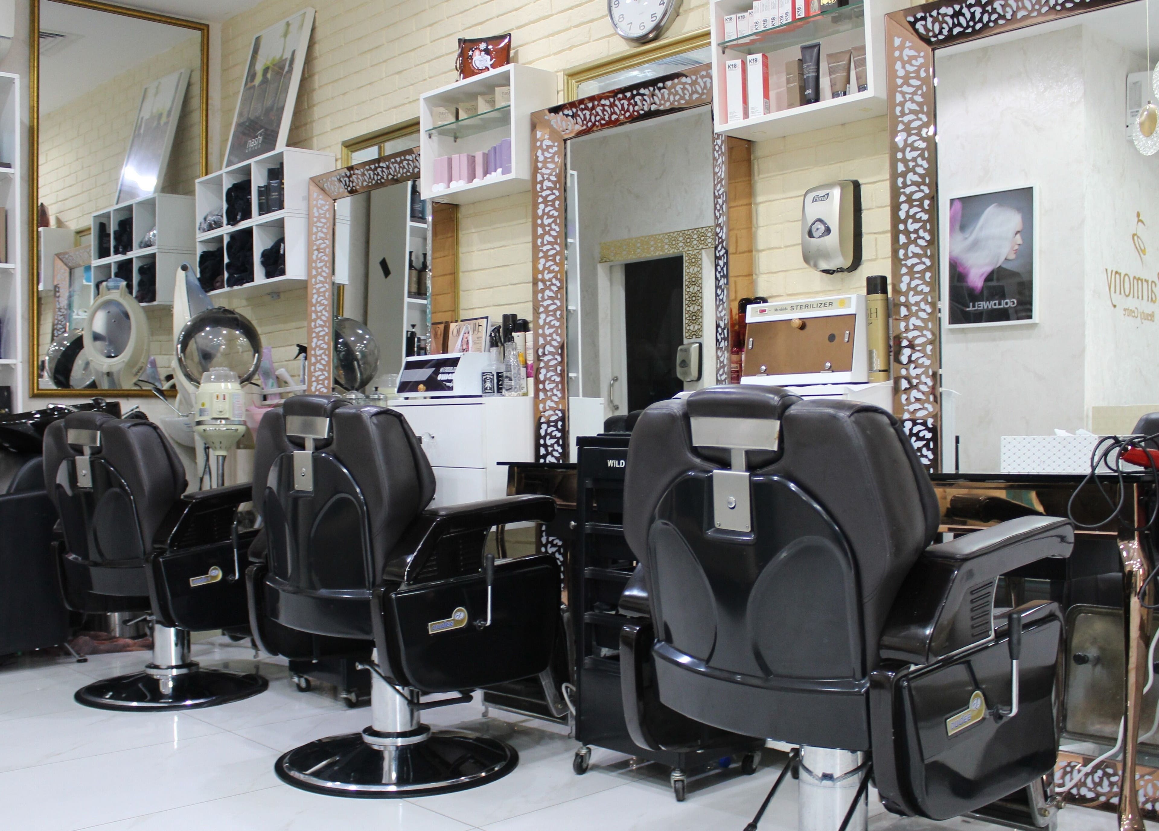 Stylish salon interior at Harmony Ladies Salon, Dubai, Dubai, AE with modern chairs and beauty products.