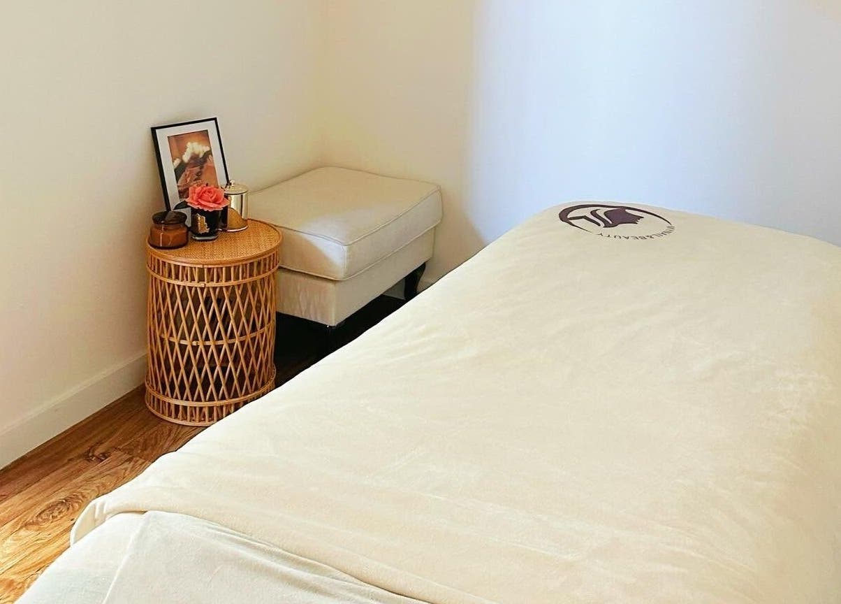 Cozy spa room at My Nail & Beauty in Christchurch, Canterbury, NZ, with plush bed and soothing decor.