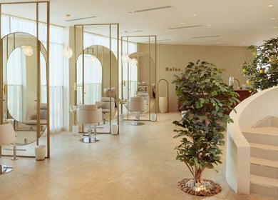 Elegant interior of Lemon Tree Nails and Hair Spa in Dammam, Eastern Province, SA with chic styling chairs.