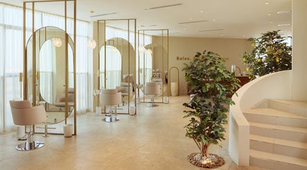 Elegant interior of Lemon Tree Nails and Hair Spa in Dammam, Eastern Province, SA with chic styling chairs.