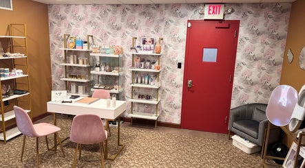 Chic interior of Zen Beauty Lounge LLC, Stroudsburg, Pennsylvania, US, showcasing beauty products and seating area.