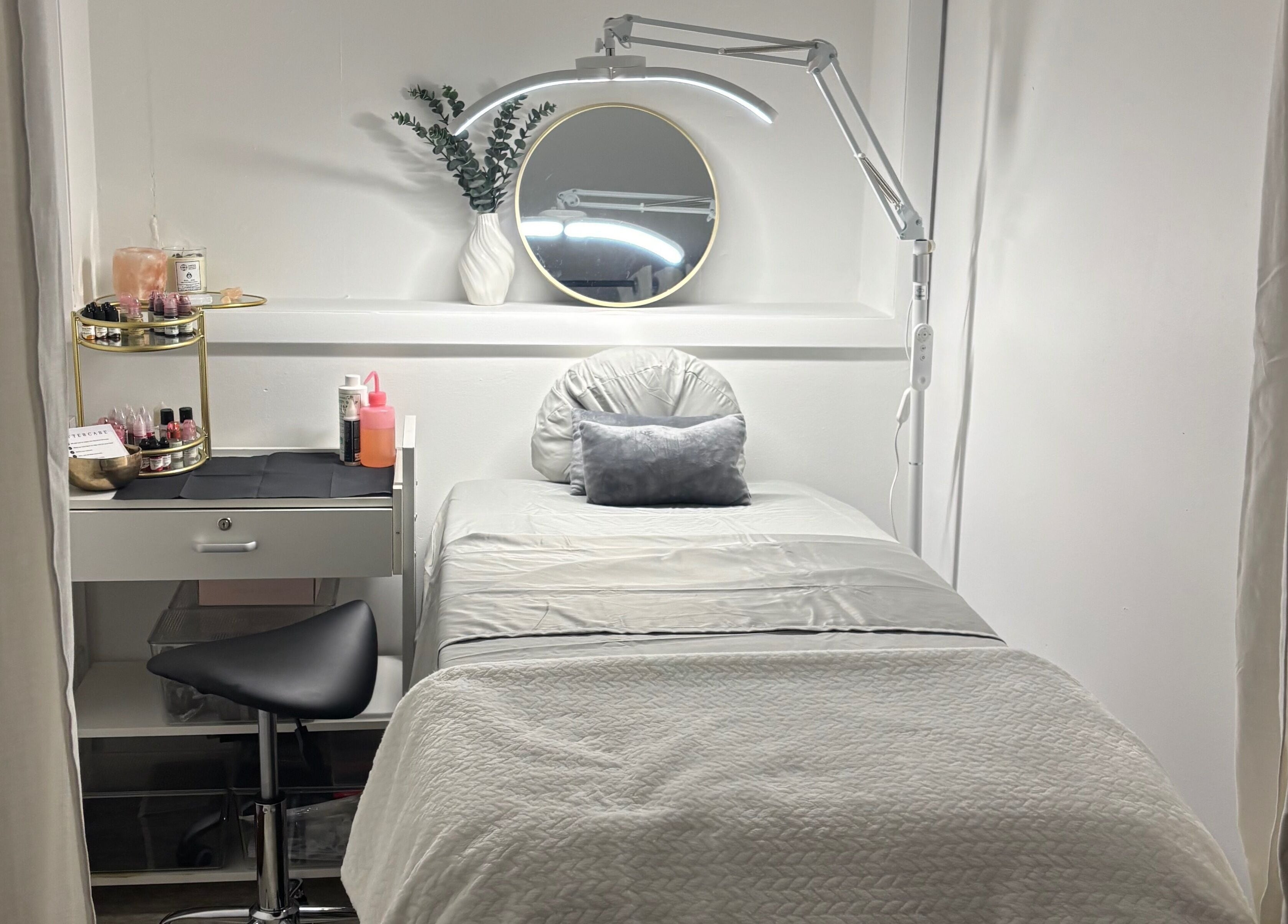 Cozy treatment room at Zen Beauty Lounge, Stroudsburg, Pennsylvania, US, with a plush bed and serene decor.