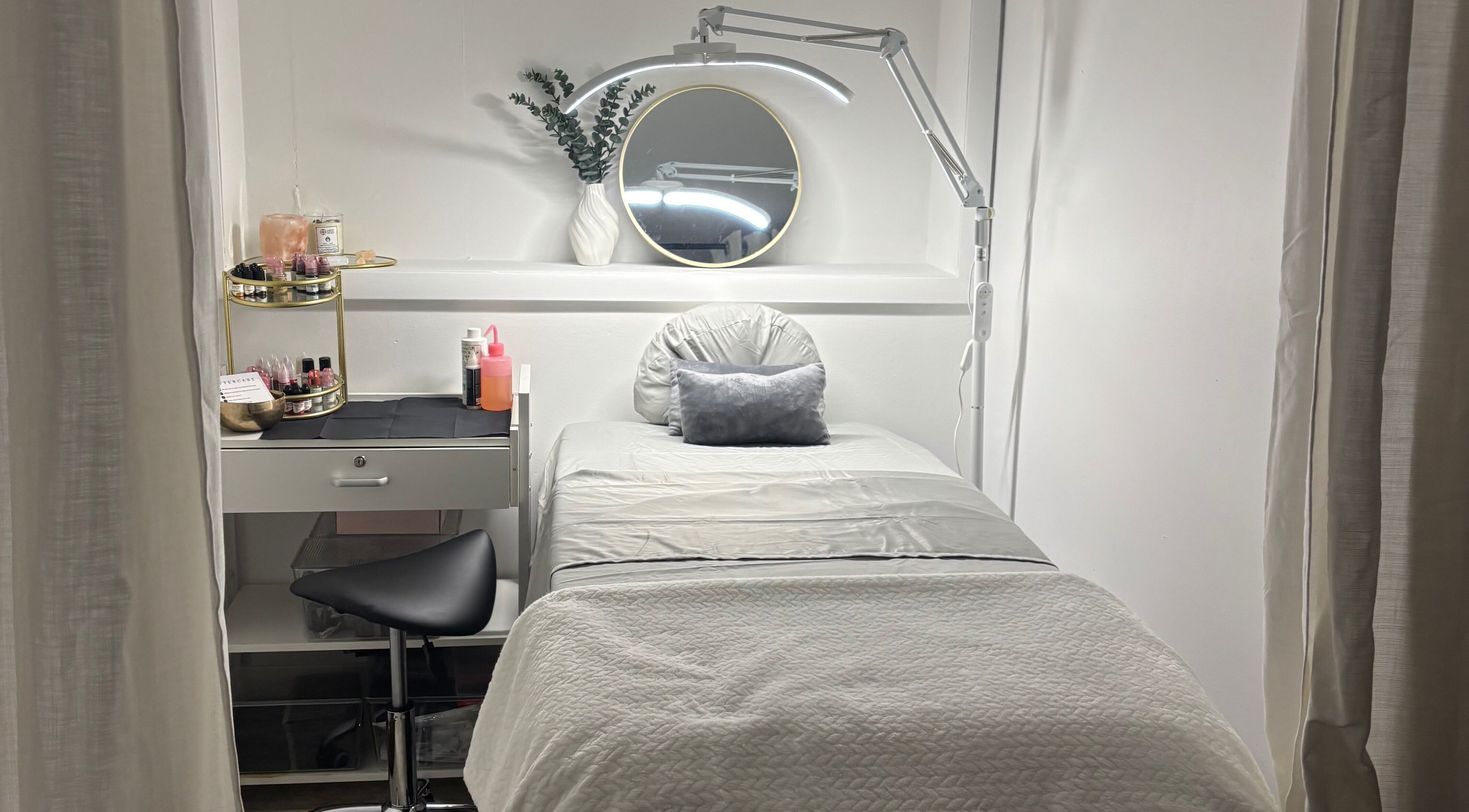 Cozy treatment room at Zen Beauty Lounge in Stroudsburg, Pennsylvania, US featuring a plush bed and a serene decor.