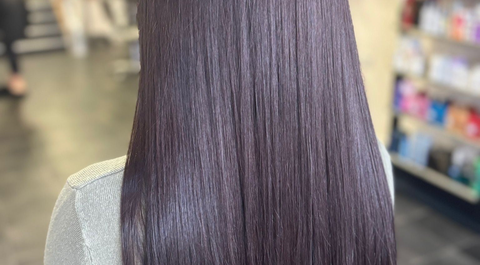 Straight, glossy hair showcased at Melanie’s Salon, Windermere, England, GB, highlighting sleek styling.