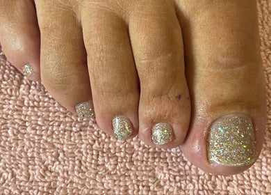 Sparkling pedicure at Princess Beauty by Sarah in Hasland, England, GB showcasing glittery toenail design.
