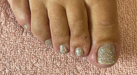 Sparkling pedicure at Princess Beauty by Sarah in Hasland, England, GB showcasing glittery toenail design.