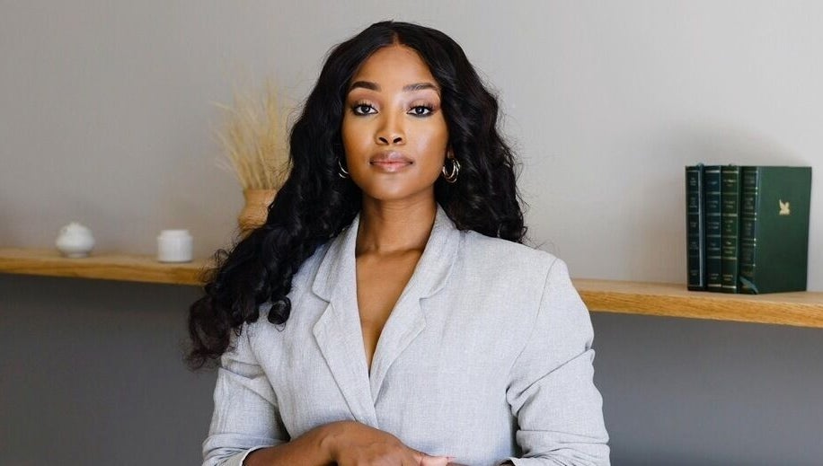 Professional woman in elegant setting at Touch by Thato Fourways, Sandton, Gauteng, ZA.