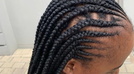 Stylish braids at Touch by Thato Fourways in Sandton, Gauteng, ZA, showcasing intricate cornrow design.