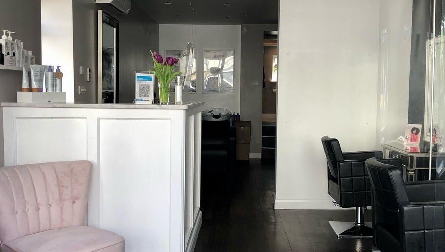 Modern salon interior at Rosie Baylis Hair, Tunbridge Wells, England, GB, featuring chic chairs and a welcoming atmosphere.